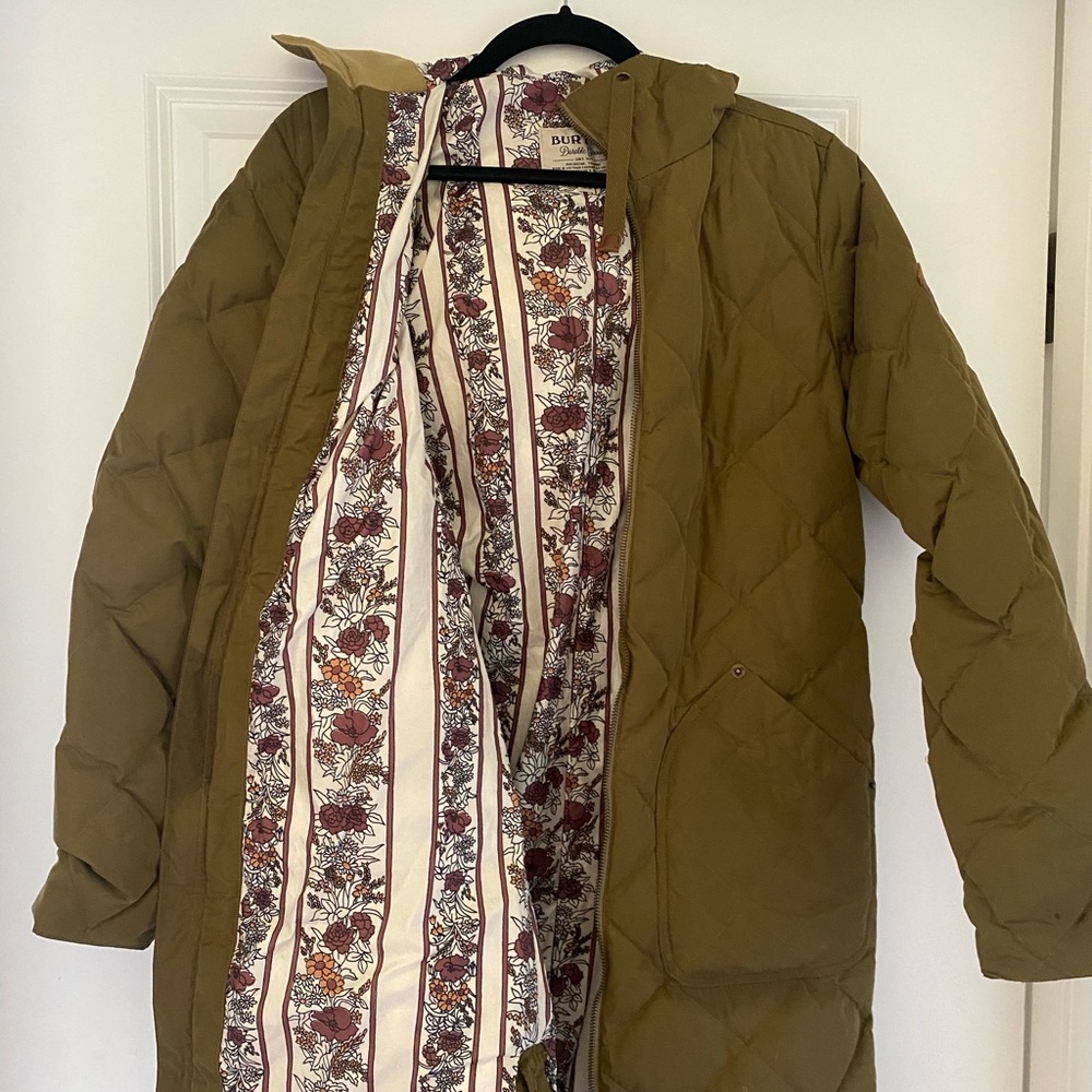 Army green down Burton jacket with floral interior pattern. Lightly worn.